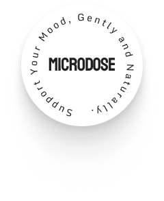 A round white label with the word "MICRODOSE" in bold center text, surrounded by the phrase "Support Your Mood, Gently and Naturally.